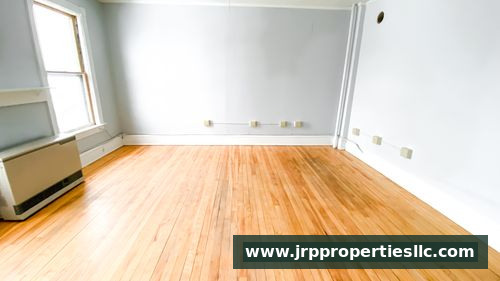 Spacious living room with hardwood floors